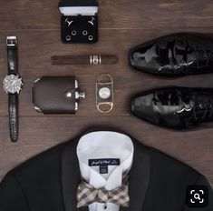 men's accessories laid out on top of a wooden table