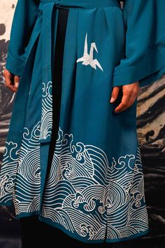 This deep teal coloured fully lined kimono is a statement piece. Inspired by Hokusai the hem features embroidered ivory waves. The upper part features embroidered ivory origami birds. The belt has embroidery detail on the tails.  Style this with jeans, shorts or over a dress or wear as a robe around the house. This kimono is super versatile to add endless style to any outfit. The outer fabric and lining are 100% Viscose.  Dry clean only. Blue Origami, Origami Birds, Alphabet Jewelry, Origami Bird, Stocking Fillers For Her, Forever Jewelry, Long Kimono, Jewelry Ring Box, Deep Teal