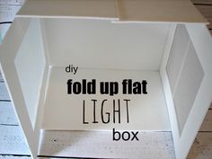 an open box with the words fold up flat light box written in black on it