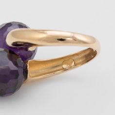 Elegant estate bypass ring, crafted in 18 karat yellow gold.   Checkerboard faceted amethyst orbs each measure 12mm. The amethyst is in excellent condition and free of cracks or crisps.     The amethysts are set in a ''Moi et Toi'' design, a French term for ''Me and You''. Great for day or evening wear. The checkerboard faceted amethysts offer a subtle shimmer with every movement of the ring.   The ring is in very good condition and was recently professionally cleaned and polished.   Particulars Luxury Faceted Amethyst Ring For Formal Events, Luxury Faceted Amethyst Ring For Formal Occasions, Fine Jewelry Yellow Gold Amethyst Open Ring, Formal Faceted Amethyst Ring Fine Jewelry, Formal Purple Faceted Ring, Formal Faceted Purple Ring, Purple Faceted Ring For Formal Occasions, Elegant Faceted Amethyst Ring In Yellow Gold, Gold Faceted Amethyst Ring