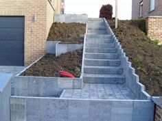 concrete steps leading up to a garage door