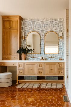 a large bathroom with wooden cabinets and tile flooring