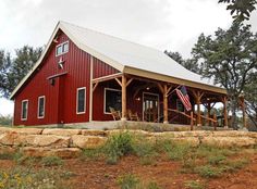 a large red barn with an american flag on the roof and two pictures of it