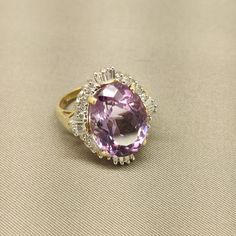 Absolutely Breathtaking! The Cut And Clarity Of The Center Stone Is Far More Beautiful Than Photos Show. Please Ask Any And All Questions Before Making Purchase. This Is A Consignment Piece From A Retired Professional Jewelry Designer, So Please No Lowballers. Ring Is 14k Gold And Size 7.25 Center Stone Size Is 12 X 16mm Ring Weighs 6 Grams Luxury Purple Gemstones With Halo Setting, Formal Pink Amethyst Ring With Gemstone Accents, Luxury Amethyst Ring With Halo Setting, Luxury Purple Amethyst Ring With Halo Setting, Exquisite Purple Amethyst Ring With Gemstone Accents, Pink Amethyst Ring For Formal Occasions, Luxury Purple Diamond Ring For Formal Occasions, Exquisite Purple Amethyst Ring With Center Stone, Timeless Purple Rings For Formal Occasions