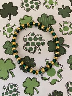 This is a St Patrick seed bead bracelet. It would make a cute gift for a little girl for St. Patrick's Day. It would be a great way to show your St. Patrick's Day spirit. It has green and gold seed beads. It was made with .8mm sturdy stretch string. I tie it several times to prevent breakage. It fits girls ages 4-7. It stretches to fit on the wrist. All items are ready to be shipped I do combined shipping. Items ship in 2-5 business days. Check out more items at: http://www.etsy.com/shop/Meshele Kids Beaded Bracelets, Kids Bead Bracelet, Gifts Bracelets, Girls Bracelets, Bracelets For Kids, Ribbon Hair Ties, Winter Market, Bracelets For Girls, Birthday Gifts For Teens