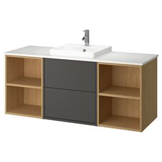 a bathroom vanity with two open shelves and a sink on the top, in front of a white background