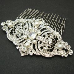 a hair comb with pearls and crystals on it