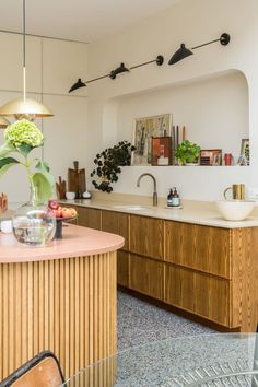 the kitchen is clean and ready to be used as a dining room or office space