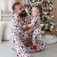 Perfect for snuggling up by the fire with a warm cup of cocoa, this adult pajama set is sprinkled with the sweetest Christmas cookies to bring some festive fun to your holiday season! This long sleeve pajama set with a button-up design fits both men and women, and has a classy collar to elevate your family matching look to make for the perfect Christmas card photo. Made from soft bamboo, these pajamas will keep you cozy throughout every winter wonderland, and were made for family matching fun. Whether you're watching your little ones open presents on Christmas morning or chestnuts roast by the open fire, these cookie PJs are the secret ingredient you've been looking for for a magical holiday season! Adult Pajama Set Details: 95% Bamboo Viscose | 5% Spandex Extra length & pockets for comfor Matching Holiday Sleepwear For Pajama Party, Family Matching Christmas Sleepwear, Matching Christmas Sleepwear For Pajama Party, Christmas Long Sleeve Loungewear Sleepwear, Christmas Long Sleeve Sleepwear Loungewear, Cozy Long Sleeve Christmas Sleepwear, Holiday Family Matching Loungewear Sleepwear, Matching Winter Sleepwear For Loungewear, Winter Matching Sleepwear For Loungewear