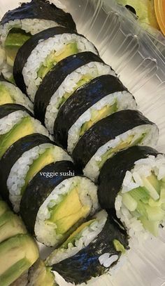 sushi with avocado and other vegetables on a plastic tray, ready to be eaten