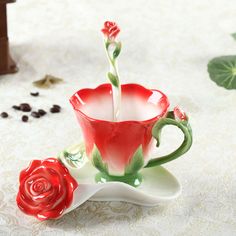 a red rose is being poured into a coffee cup