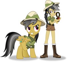 two ponies are standing next to each other and one is holding an object in her hand