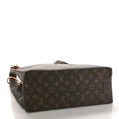 This is an authentic LOUIS VUITTON Monogram Atlantis GM. This chic shopping bag shape is crafted of monogram-coated canvas. It features top handles that can be belted together, a vachetta name tag, and polished brass hardware. The top is open to a beige interior . Louis Vuitton Monogram Bag, Beige Interior, Louis Vuitton Empreinte, Louis Vuitton Vernis, Heart Chain, Louis Vuitton Shoulder Bag, Monogram Bag, Name Tag, Chain Bags