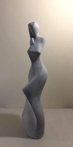 a white sculpture sitting on top of a table