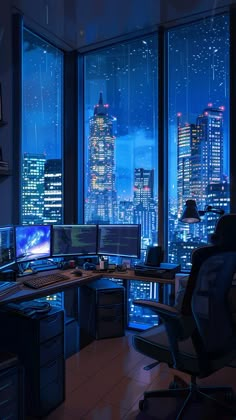 an office with large windows overlooking the city at night