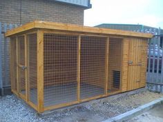 a dog kennel in front of a brick building