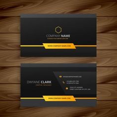 two black and yellow business cards on wooden background with place for your own logo or text