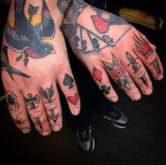 two hands with different tattoos on them