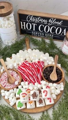 a platter filled with marshmallows, hot cocoa and other holiday treats