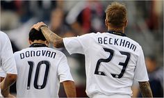 two soccer players saluting each other with their hands