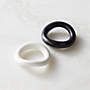 two black and white rings sitting on top of a table