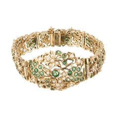 Emerald and pearl hinged link bracelet. 104 round emeralds in an open work 14k yellow gold bracelet with 65 accent seed pearls. 104 round green emeralds, approx. 2.80cts 65 crème seed pearls 14k yellow gold Stamped: 14k 37.9 grams Bracelet: 7 Inches Width: 2.5-13mm Thickness/Depth: 3mm Elegant Green Gold Bracelet For Wedding, Yellow Gold Emerald Bracelets For Wedding, Emerald Jubilee Bracelet For Wedding, Victorian Green Bracelet Jewelry, Elegant Green Gold Bracelet For Formal Occasion, Victorian Art Deco, Antique Wedding Bands, Diamond Sapphire Engagement Ring, Cultured Pearl Bracelet