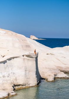 a person standing on the edge of a cliff