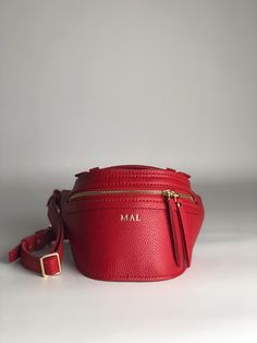 Women's fanny pack handmade from natural materials for connoisseurs of handmade, quality and exclusive things. This simple leather cross body bag has everything you need and more, whether you're shopping, cycling or traveling. Beloved for its versatility and stylish looks, this belt bag holds everything you need and more. Fashionable leather belt bag in a minimalist style in thick red leather Material: Italian textured leather Leather Color: red Fittings: High quality Italian fittings Furniture color: colors gold Zipper sk Italy - colors gold Overall size: width 15,7" - 40 сm height 6,7" - 17 сm thickness 5,1" - 13 сm Strap size: width 0,9" - 2,5 сm length 43,3" - 110 сm Handle size: width 0,7" - 2 сm length 4,7" - 12 сm -------------------------------------------------- ------------------ Red Pouch Belt Bag For Travel, Red Travel Pouch Belt Bag, Handmade Pouch Belt Bag For Gifts, Handmade Pouch Belt Bag As Gift, Handmade Belt Bag Pouch As Gift, Handmade Rectangular Belt Bag As Gift, Handmade Rectangular Belt Bag Gift, Red Rectangular Belt Bag For Travel, Crossbody Pouch With Adjustable Strap For Gift