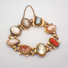 "Vintage 14k (.585) yellow gold bracelet, made of 8 slider links, decorated with cameo insets and alternating with gold beads. This outstanding bracelet is 7 1/2\" long, 22 mm wide, weighing 48.9 grams. EA3827" Gold Charms For Bracelets, Slider Bracelet, Slide Bracelet, Charms For Bracelets, Gold Armband, Cameo Jewelry, Gold Charm Bracelet, Funky Jewelry, Yellow Gold Bracelet