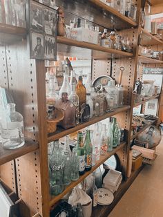 the shelves are filled with bottles and other items