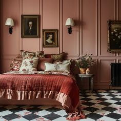 a bedroom with pink walls and black and white checkered flooring, two paintings on the wall