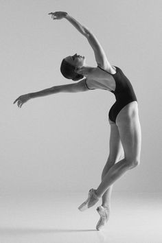 a black and white photo of a ballerina