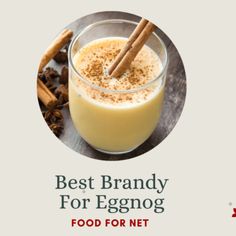 the best brandy for eggnog is in a glass next to cinnamons and cloves