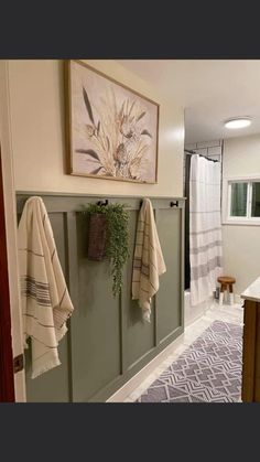 a bathroom with towels hanging on the wall