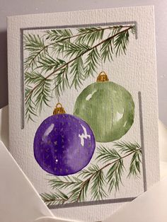 an ornament card with two ornaments on it