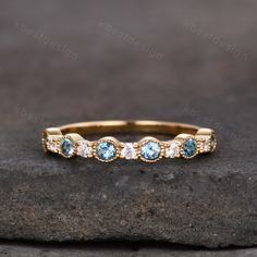 This is a beautiful blue topaz and moissanite ring in yellow gold. Perfect gift for Wedding,Christmas,Birthday,New Year:) The stones are 2.5mm blue topaz + moissanite The band is marked S925/G10K/G14K/PT950.(If you are allergic to nickel, we recommend Platinum) I accept custom making order, the stones can be changed. Please contact me if you need this service. All the jewelry in my store is handmade.It may take 2-3 weeks to finish. Friendly reminder: For special customized products do not accept Blue Topaz Wedding Band, Diamond Topaz Ring, Aquamarine Wedding, Wedding Band Unique, Wedding Band Women, Band Art, Moissanite Wedding Band, Deco Blue, Customized Products