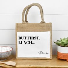 a jute bag sitting on top of a wooden table