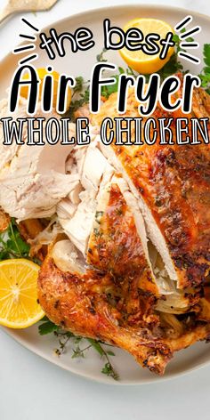 the best air fryer whole chicken recipe on a plate with lemons and parsley