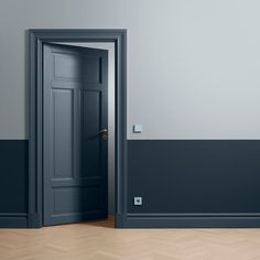 an open door in a room with grey walls and parquet flooring on the side