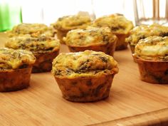 several muffins are sitting on a cutting board