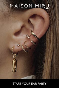 a woman with three ear piercings on her left ear and the words, start your ear party