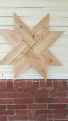 a wooden star on the side of a building