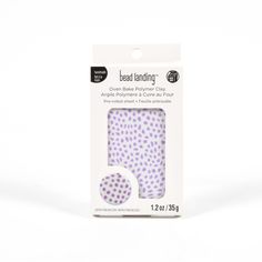 the packaging is white and has purple polka dots on it