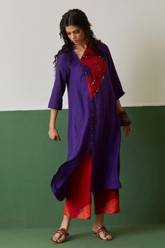 Purple tunic with mirror, sequin embroidery and tie and and dye semi circular placement detailing.
Components:1
Pattern:Embroidery
Type of Work:Mirror, sequin
Neckline:Asymmetric
Sleeve Type:Three quarter
Fabric:Habutai silk
Color:Purple
Other Details:
Front potli button detailing
Note: Pant and dupatta worn by the model is not for sale
Occasion:Puja - Aza Fashions Bollywood Style Embroidered Dress With Mirror Work, V-neck Dresses With Mirror Work For Diwali, Diwali V-neck Dresses With Mirror Work, Traditional Summer Kurta With Sequins, Traditional Sequined Summer Kurta, Anarkali Tunic Dress With Mirror Work, Embellished Multicolor Kurta For Eid, Navratri Long Sleeve Sequin Dresses, Embellished Tunic Kurta For Party