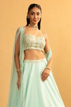 Ice blue blouse with gota work embroidery. Paired with lehenga and cape. - Aza Fashions Fitted Sets With Dori Work For Reception, Fitted Tops With Dupatta For Reception, Fitted Wedding Tops With Dupatta, Fitted Wedding Top With Dupatta, Fitted Tops With Dupatta For Navratri, Fitted Choli With Dori Work, Fitted Cutdana Choli, Lehenga Pattern, Gota Work