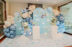 balloons and decorations are set up for a baby's first birthday