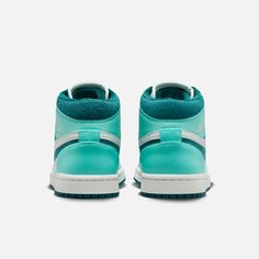 Style No. DZ3745-300 Color: Bleached Turquoise/Barely Green/Sail/Sky J Teal Dope sneakers count as self-care. And with colors inspired by the aisles of your neighborhood beauty supply store (plus cloud-like Nike Air cushioning underfoot), these mid-top J's will have you feeling anything but mid. Go ahead—treat yourself. Two sets of laces lets you switch it up. Patent leather toe overlays and textile underlays create a mixed-media effect. Nike Air-Sole unit in the heel delivers signature cushioni Wmns Air Jordan 1, Air Jordans Women, Air Jordan 1 Mid Se, Beauty Supply Store, Jordans Women, Marina Blue, Mid Top, University Blue, Air Jordan 1 Mid