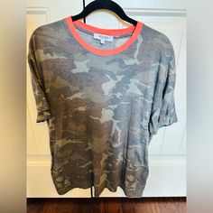 Nwt Camo T-Shirt With Orange Neck Super Soft Size Large Casual Camouflage T-shirt Relaxed Fit, Camouflage Graphic Print Relaxed Fit Tops, Camouflage Graphic Print Relaxed Fit T-shirt, Casual Camouflage Relaxed Fit T-shirt, Camouflage Crew Neck Graphic Tee, Camouflage Short Sleeve T-shirt With Relaxed Fit, Camouflage Relaxed Fit Short Sleeve T-shirt, Spring Camouflage Cotton T-shirt, Camouflage Tops With Graphic Print For Spring