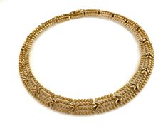 "This signed Monet gold necklace was created from interlocking links to create the appearance of a collar. The gold tone links have both bright and textured finishes which give this piece a nice dose of visual interest. SIZE/CONDITION: This vintage necklace is in excellent condition. About 16\" long and about 1/2\" wide. LINKS: I carry a wide variety of items in my shop (growing by the day). Here are some links to popular categories in my shop - the link to page with coupon codes is at the end. Gold Link Chain Necklace With 17 Jewels, Yellow Gold Link Necklace, Gold Chain Necklace, 16 Inch For Formal Occasions, Gold Chain Link Costume Jewelry Necklace, Vintage Yellow Gold Link Necklace, Gold Choker With 17 Jewels, Vintage Gold Chain Link Necklace, Vintage Gold Link Necklaces, Vintage Yellow Gold Chain Link Necklace