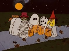 three cartoon characters dressed as ghostes sitting on the ground